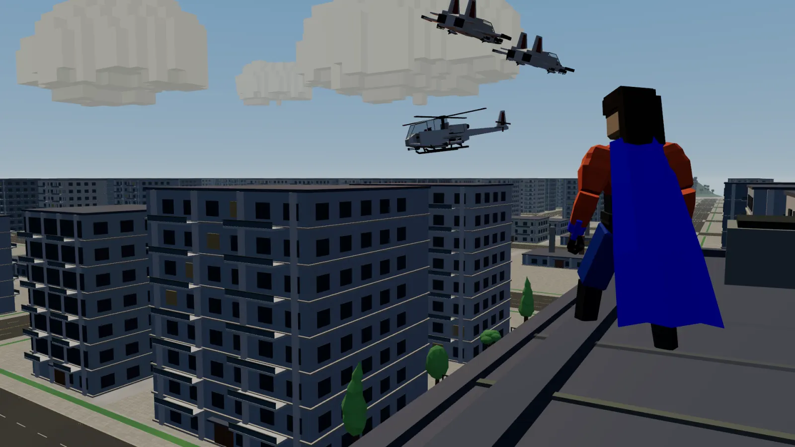 A caped hero in red and cobalt stands on a rooftop ledge above a blocky city grid while two jets and an attack helicopter fly past.